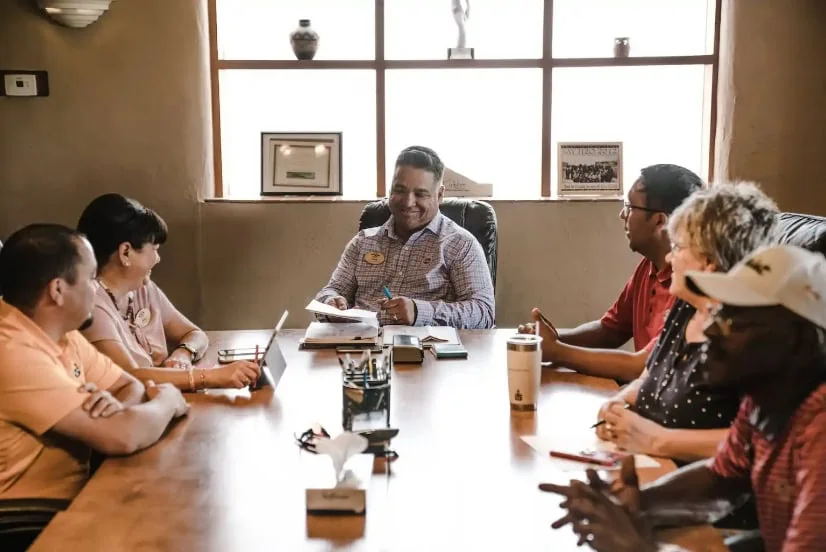 Group in discussion around a conference table